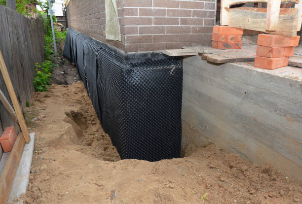Happy homeowners after waterproofing job in Selma